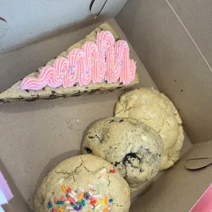 a box of cookies and a slice of cake