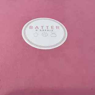 a pink box with a logo on it