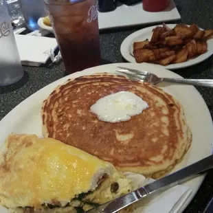 turkey bacon, spinch and vegetables with cheese, country potatoes and a pancake