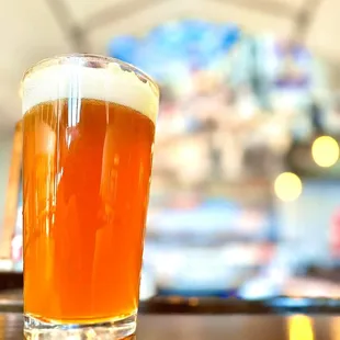 a glass of beer on a table
