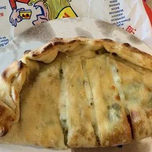 Sausage, cheese, onion and pepper calzone.