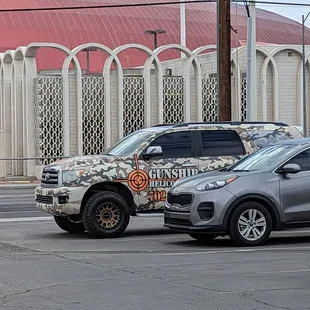 a car and a truck in a parking lot