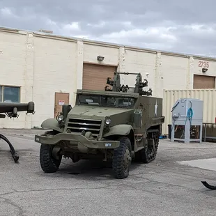 a military vehicle parked in a parking lot