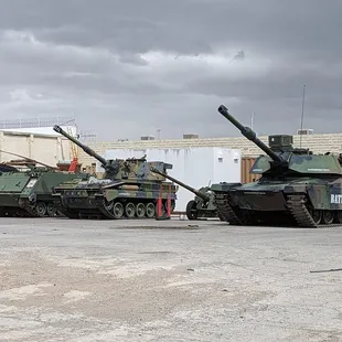 a line of tanks in a parking lot