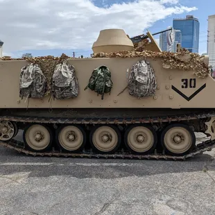an old tank with camouflage on it
