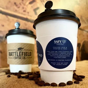 a coffee cup and coffee beans