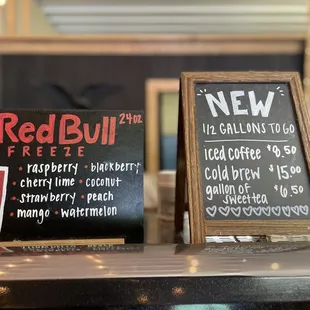 a menu and a red bull sign