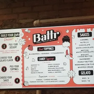 a menu on a brick wall