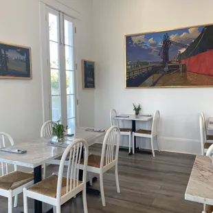 a dining room with tables and chairs
