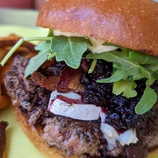 Briebg Burger - blackberry coulis, bacon, brie, crunchy garlic, arugula, lemon garlic aioli with fries