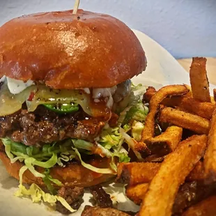 The Fogo, , ground Wagyu,  jalapeño, bauers wing sauce, pepper jack, blue cheese dressing lettuce , tomato