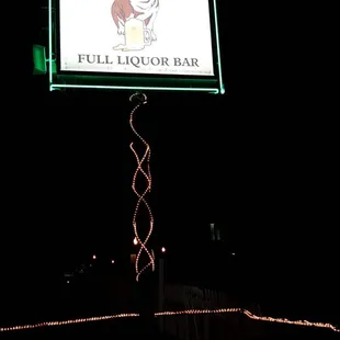 a lighted sign for bauser&apos;s full liquor bar