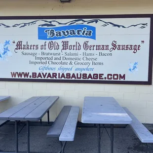three picnic tables in front of a restaurant