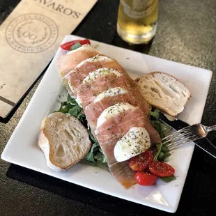 a plate of food and a beer