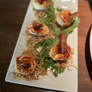 Deviled eggs with candied bacon