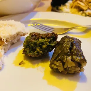 Falafel and grape leaf stuffed with rice, herbs and lemon juice