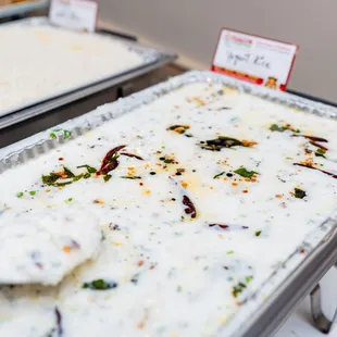 two pans of food on a table