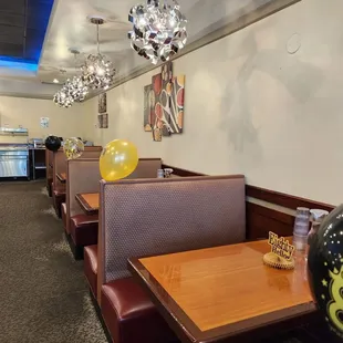 a restaurant with booths and tables