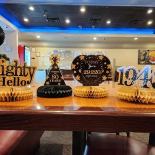 a table with cupcakes and decorations
