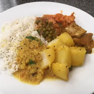 a plate of food with rice and vegetables