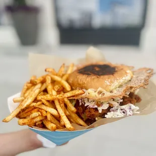 Mother clucker chicken w/ fries $25 as of 2022 Unfortunately, I don&apos;t do fast food Elaine, Howlin Ray&apos;s is also not fast food