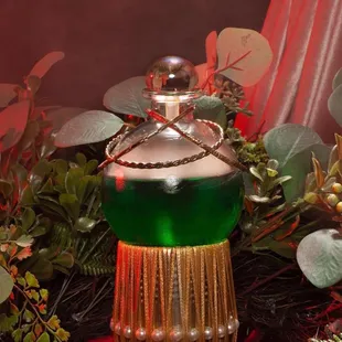 a green and gold bottle