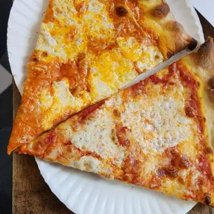Vodka sauce pizza on the left. Regular cheese pizza on the right. Both fantastic!