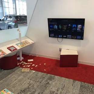 TV room. It looks like it's been changed into a kids room.