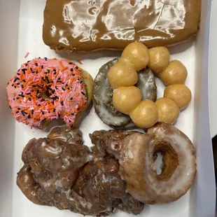 Apple fritter, mochi donut, strawberry cake sprinkle donut, maple long John, blueberry old fashioned, lemon old fashioned