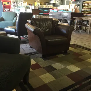 a couch and chair in a coffee shop