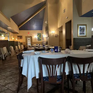 a dining room with tables and chairs