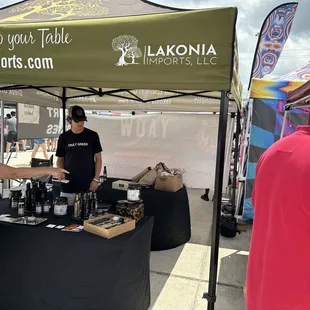 two men selling wine