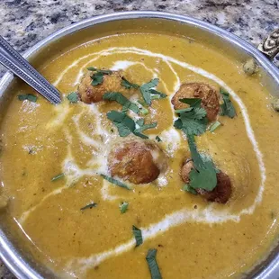 a bowl of soup with croutons