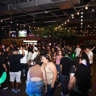 a crowd of people at a bar