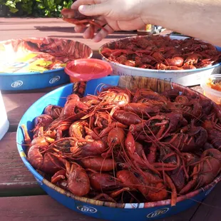 a bowl of craws and a bowl of shrimp