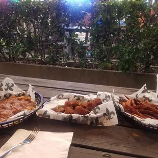 Brocolli cheese bites in the middle, sweet potato fries, and tator tots with chilli and cheese.
