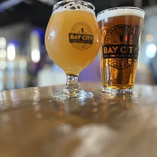 two glasses of beer on a table