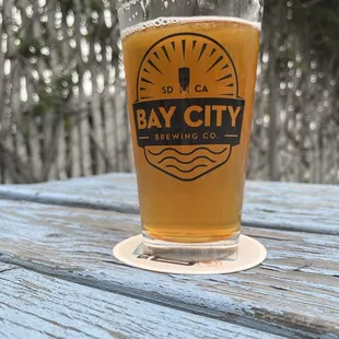 a glass of beer on a table