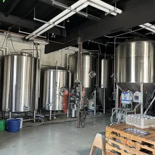 a row of stainless steel tanks