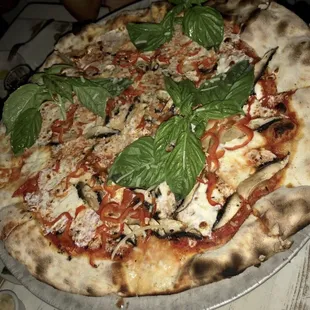 Sausage and basil pizza