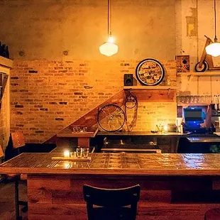 a bar with chairs and a counter