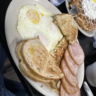 3 eggs over easy with hash, Canadian bacon and rye toast