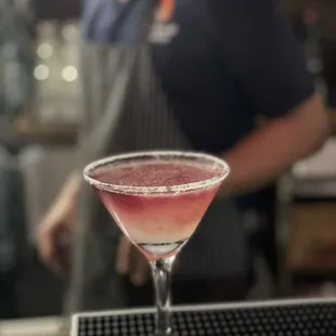 a bartender preparing a cocktail