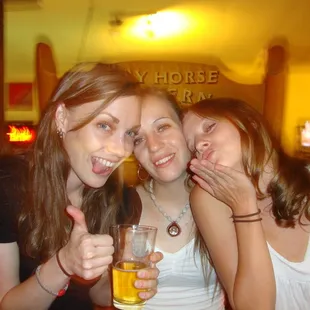 three women drinking beer