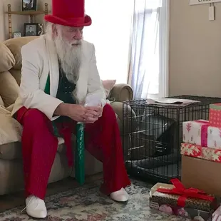 a man in a top hat sitting on a couch