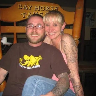 I don&apos;t know who they are, but that&apos;s the damn giant chair and obviously the booze works, look at those smiles.