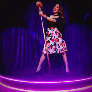 a woman singing on stage