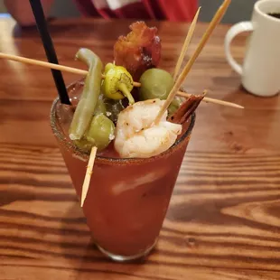 The Bay Local Bloody with shrimp skewer, bacon, and blue cheese stuffed olives.