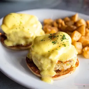 Yummy Crab Cake Benedict with our house made hollandaise and served with breakfast potatoes!