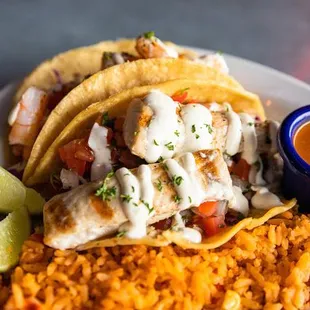 Taco Plate comes with your choice of two tacos, red rice, and beans! Don&apos;t forget to come in for Taco Tuesday!